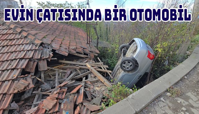 EVİN ÇATISINDA BİR OTOMOBİL